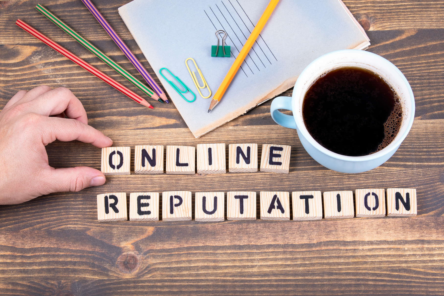 Online Reputation. Wooden letters on the office desk